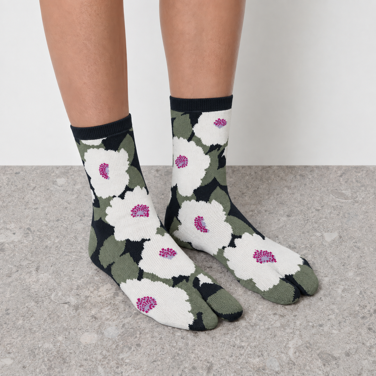 Model wearing green floral print Jacquard Print Tabi Socks seen from the front