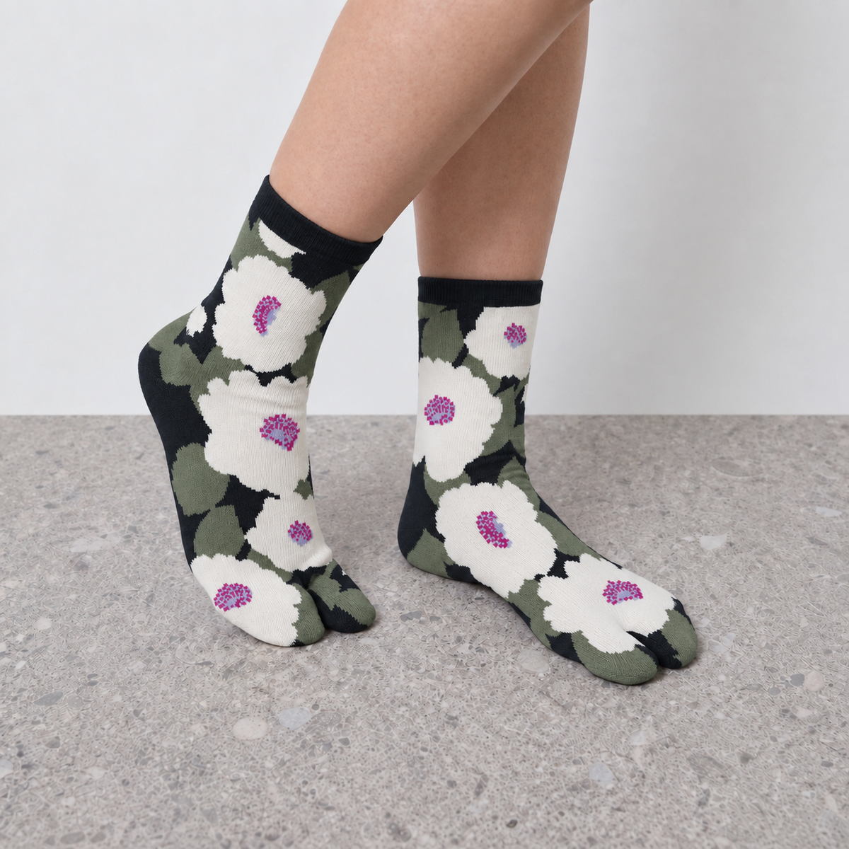 Model wearing green floral print Jacquard Print Tabi Socks seen from the side
