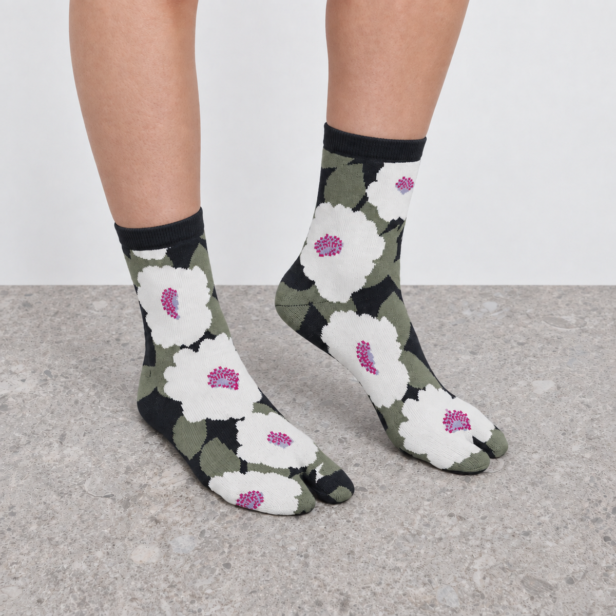 Model wearing green floral print Jacquard Print Tabi Socks seen from behind