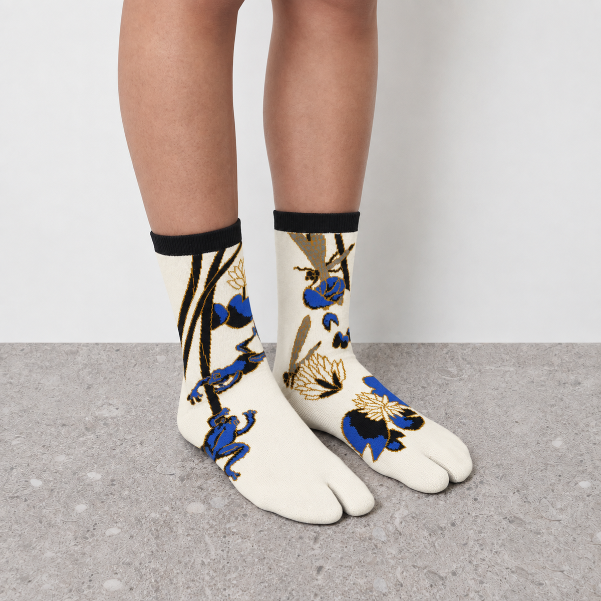 Model wearing white lotus print Jacquard Print Tabi Socks seen from the front