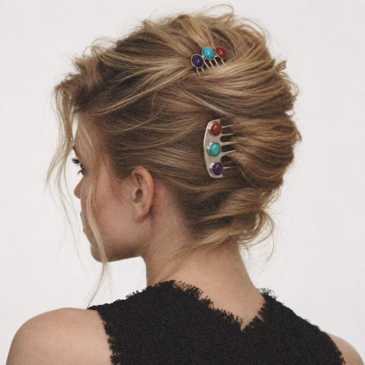 Model wearing the Jewelled Hair Comb seen from the side
