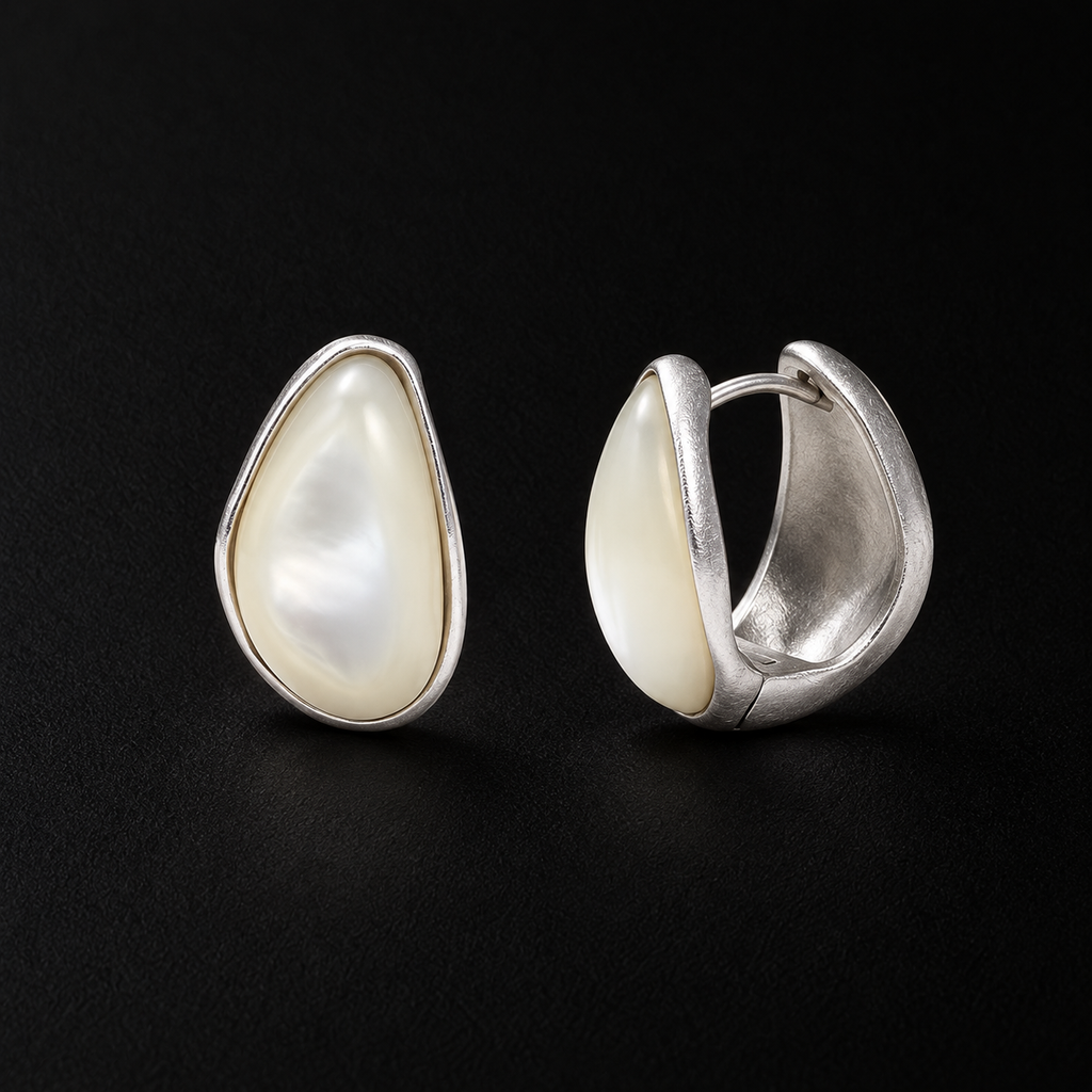 Close detail of the Lune Chunky Huggie Earrings surface and finish