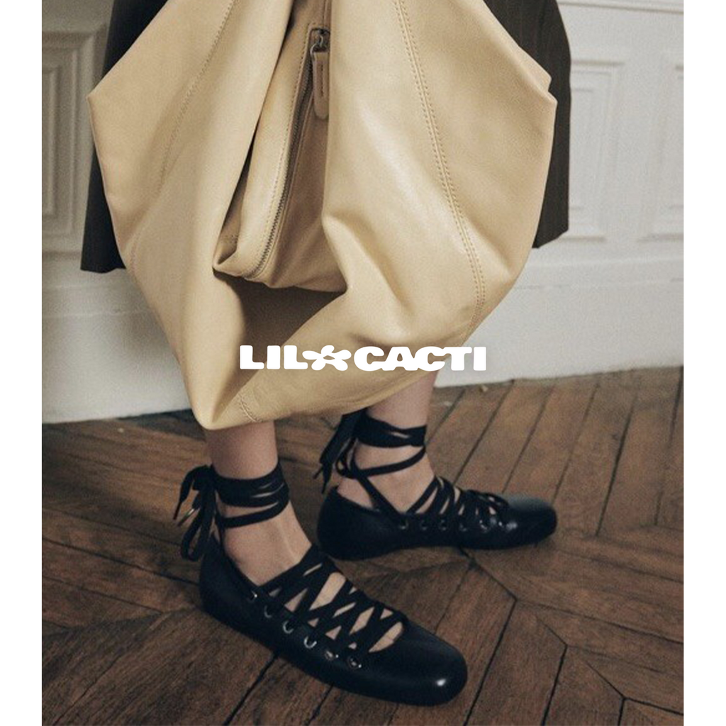 Mara black leather lace-up ballet flats with multi-strap ankle tie, lifestyle shot by lil cacti