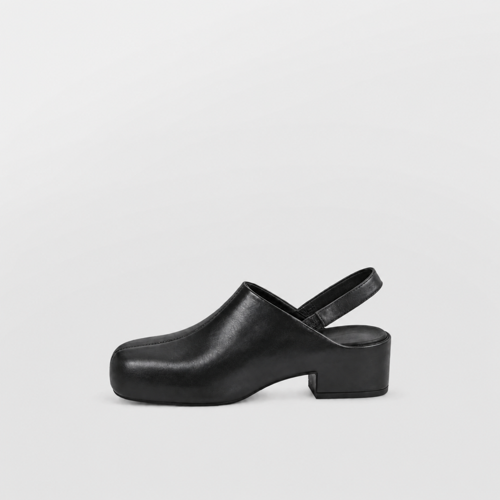 Black platform slingback clog shown alone in profile on a pale background