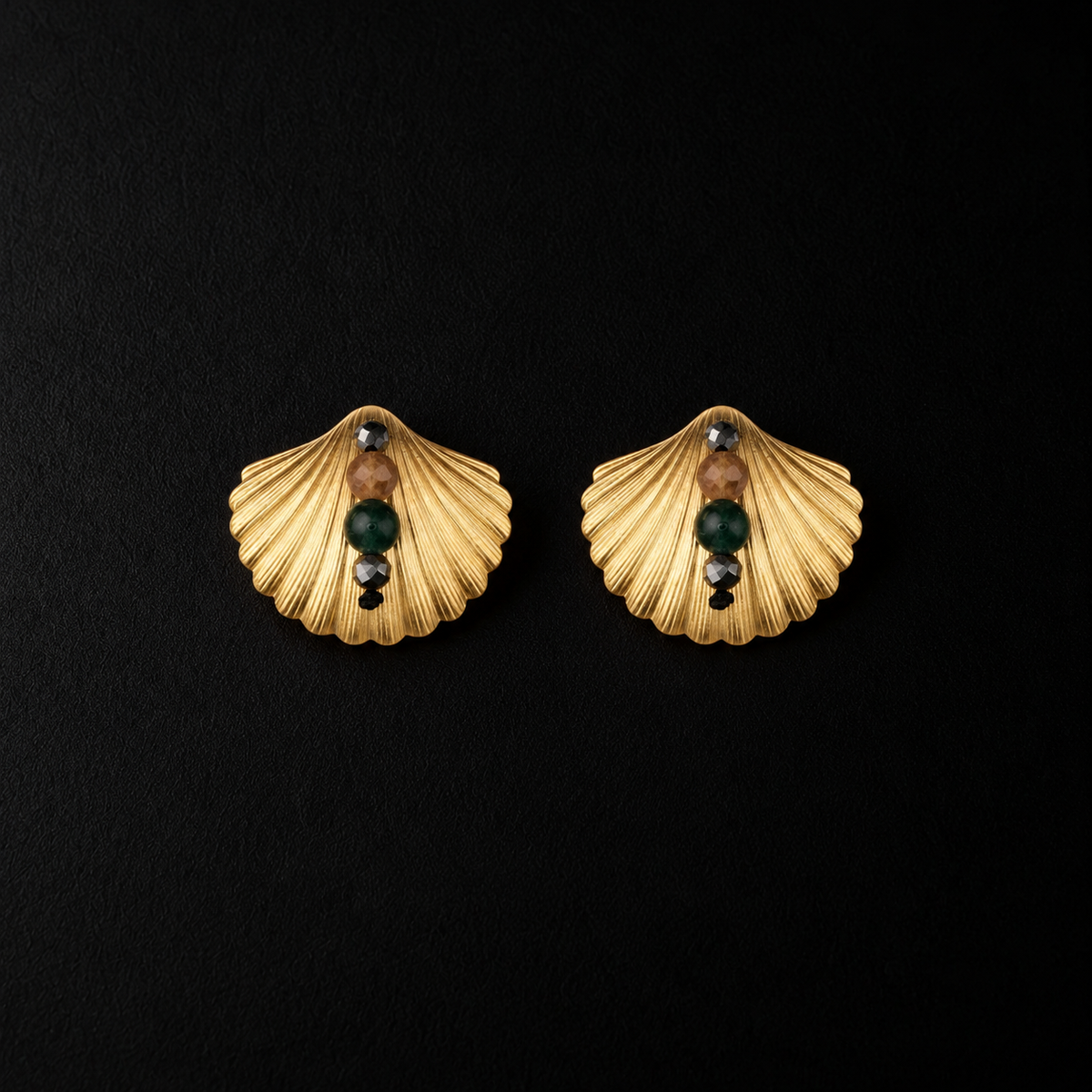 Lil Cacti seashell stud earrings showing shape and finish on dark background