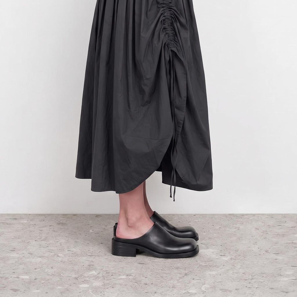Model wearing Marlowe Square-Toe Mules by Lil Cacti, view 1