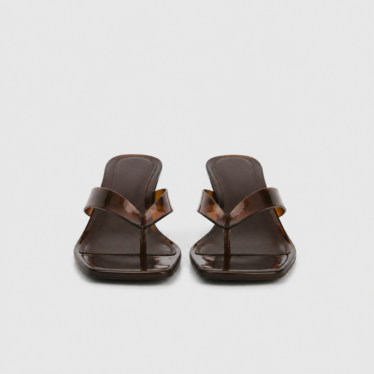 Mirage Thong Sandals by Lil Cacti — front view of brown pair showing square toes and translucent toe-post straps