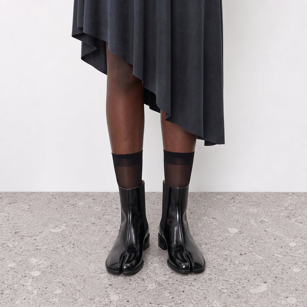 Nadia black tabi Chelsea boots on the model, both feet seen front on