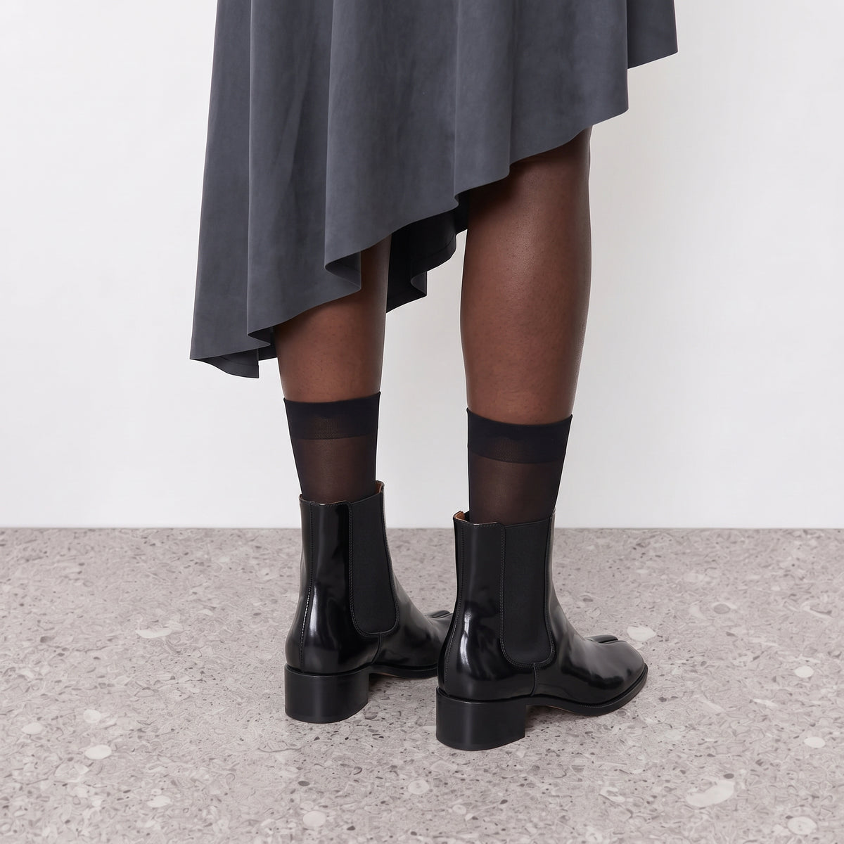 Back view of Nadia tabi Chelsea boots on the model, low block heel and elastic side panel
