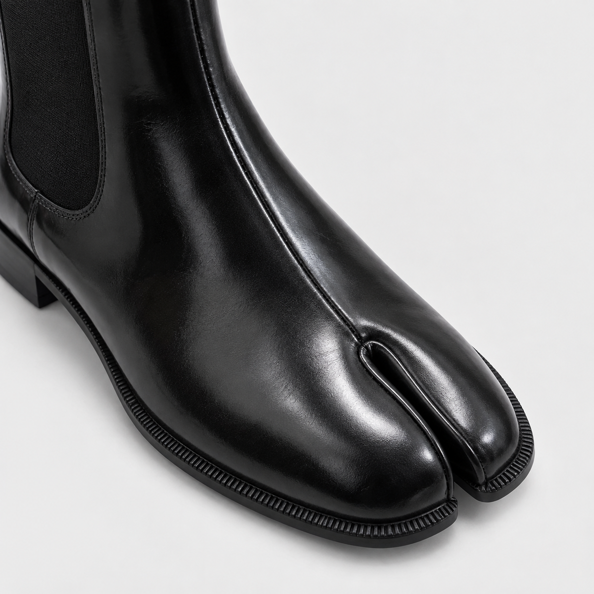 Close-up of the split toe and ridged sole edge on Nadia tabi Chelsea boots