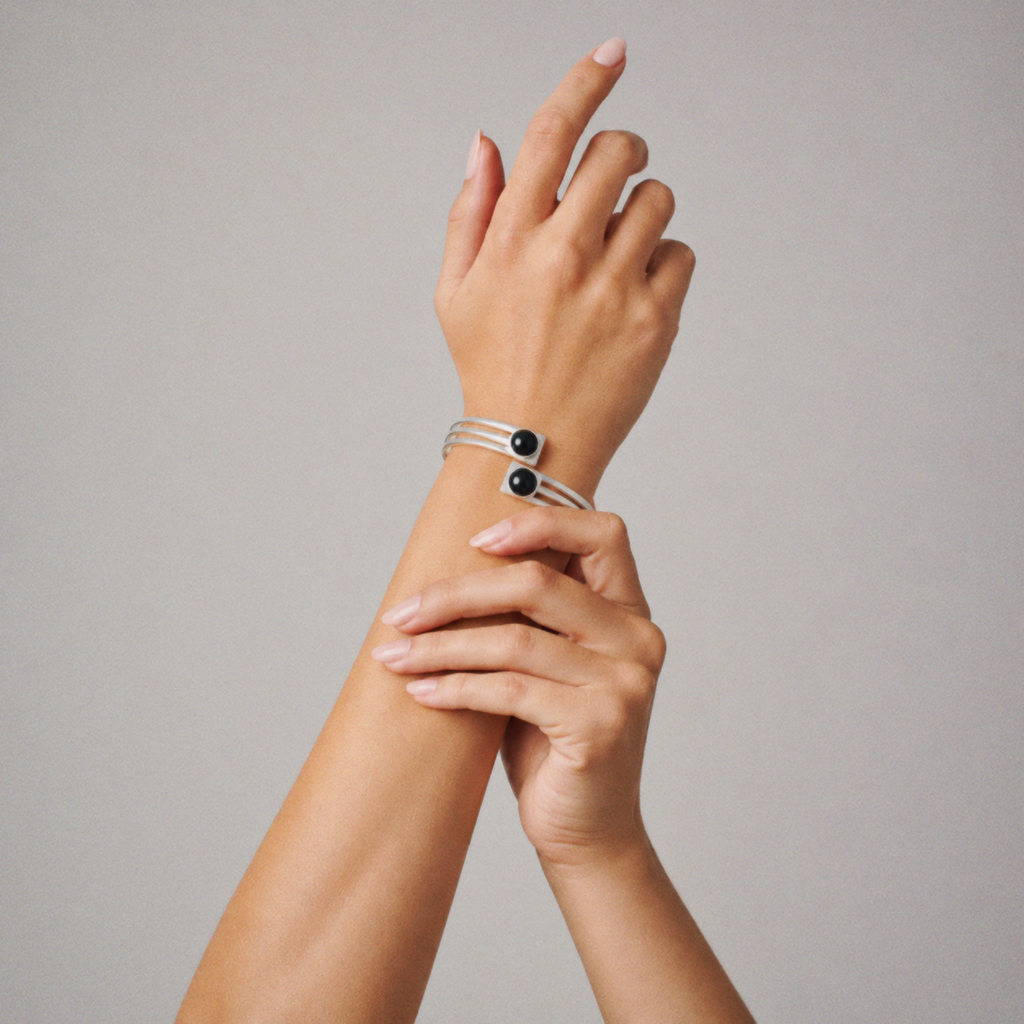 Model wearing Lil Cacti black onyx-look cuff bracelet in a close detail view