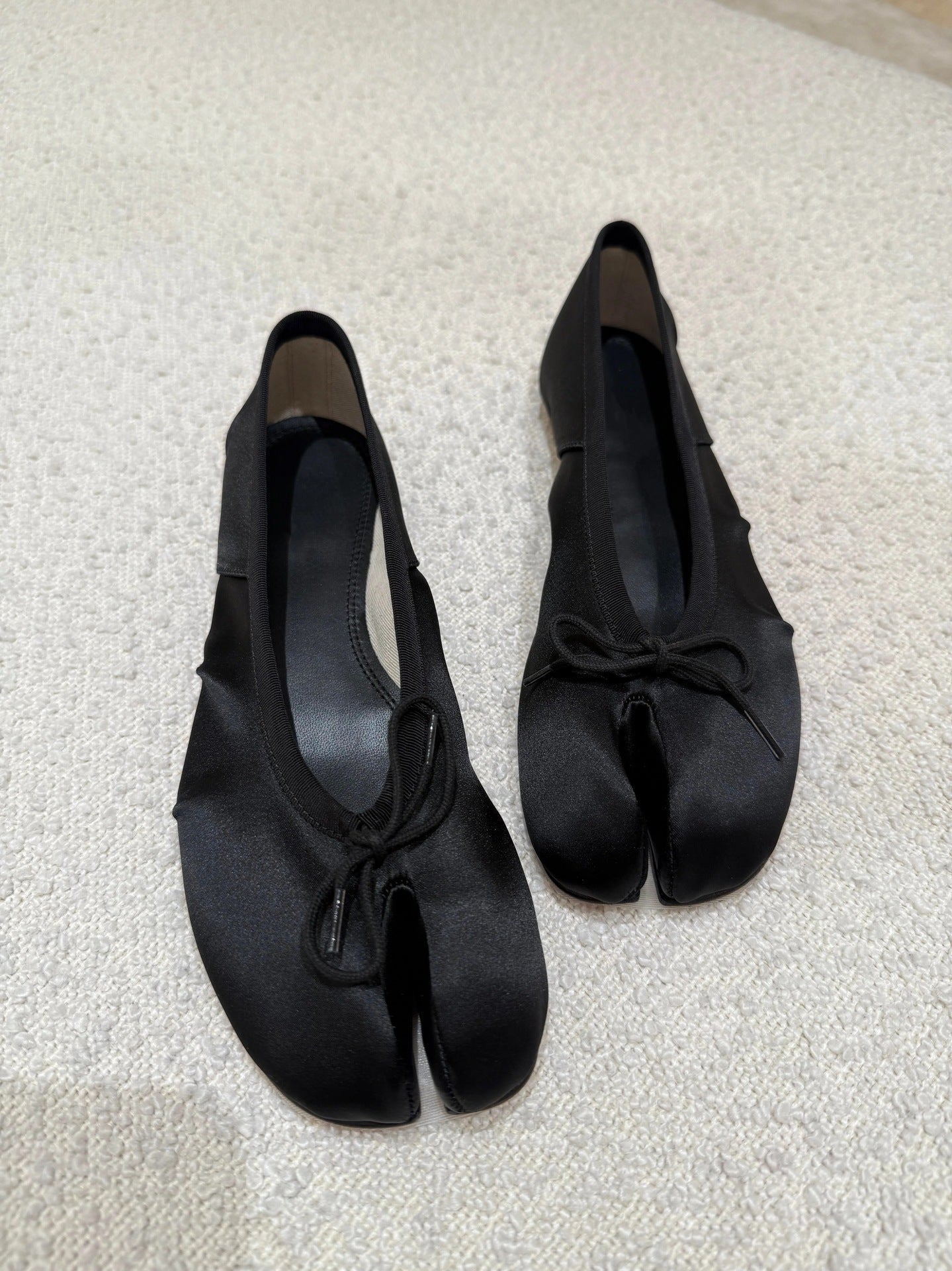 Evelyne black satin tabi ballet flats back view showing clean silhouette