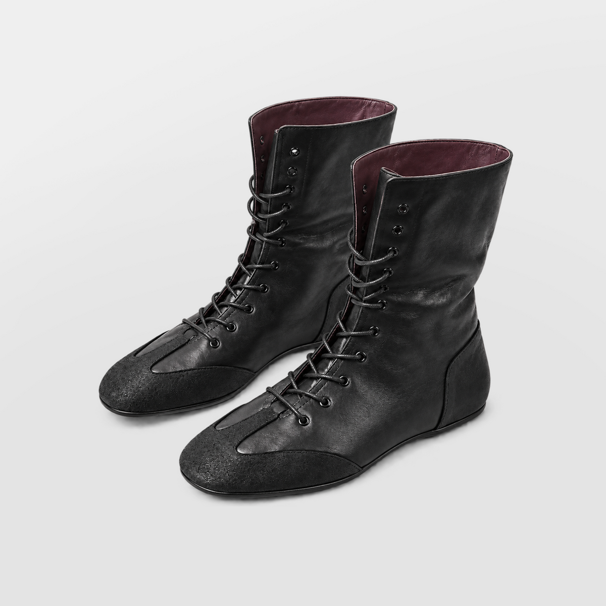 Ottilie Lace Up Combat Boots shown at a three quarter angle in studio light