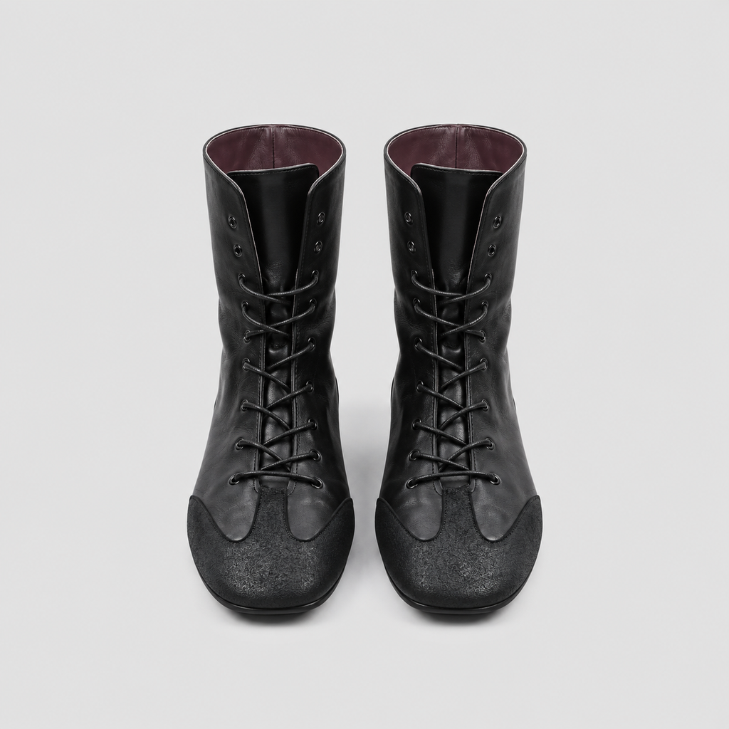 Front view of the Ottilie Lace Up Combat Boots in studio light