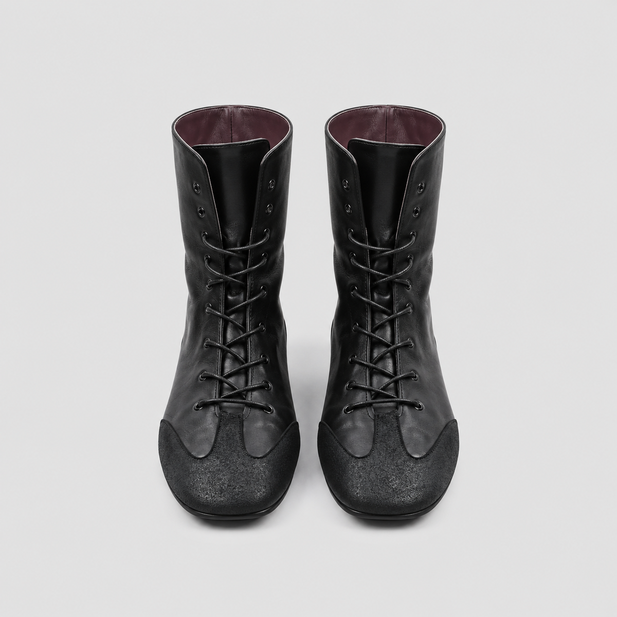 Front view of the Ottilie Lace Up Combat Boots in studio light