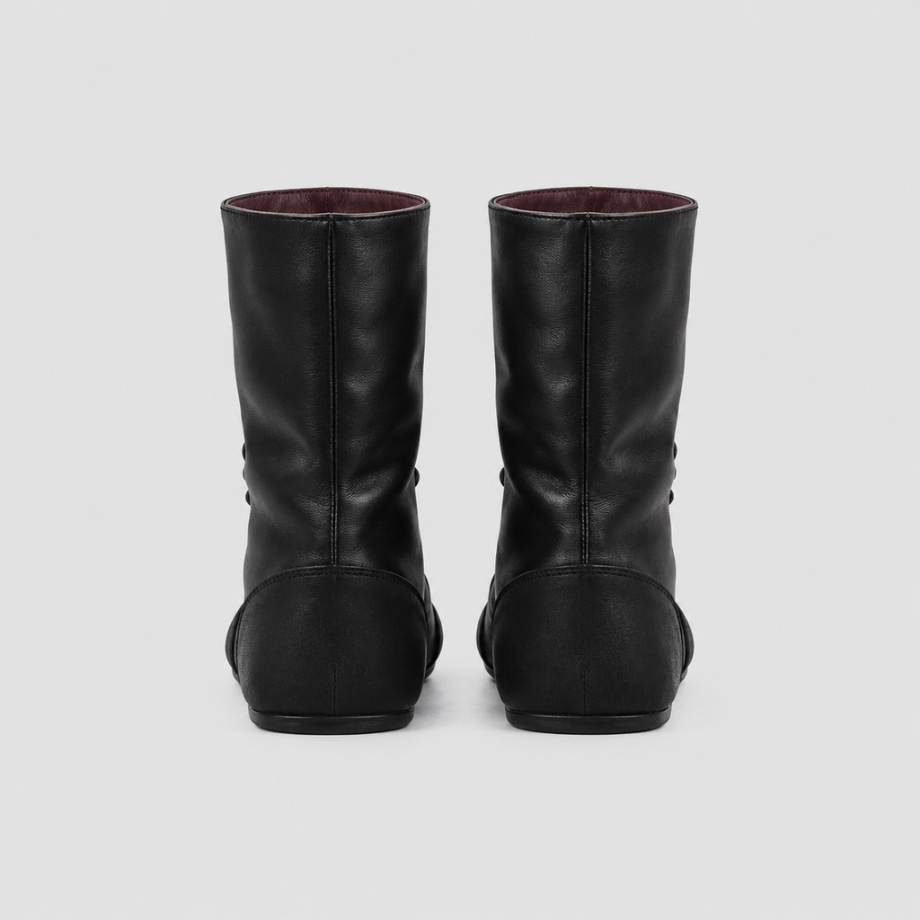 Back view of the Ottilie Lace Up Combat Boots in studio light