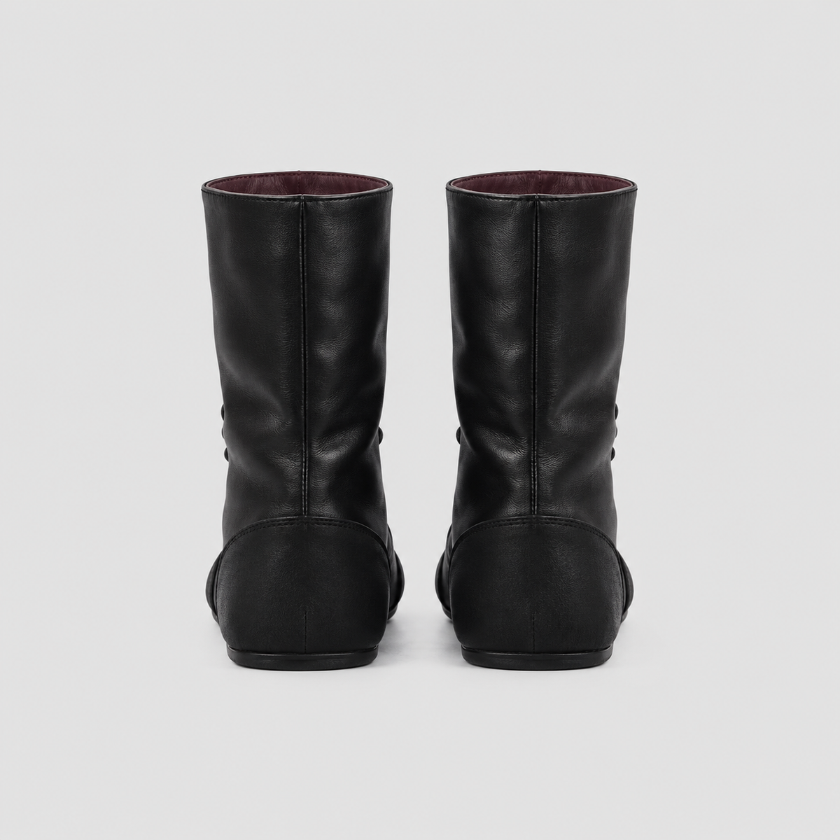 Back view of the Ottilie Lace Up Combat Boots in studio light