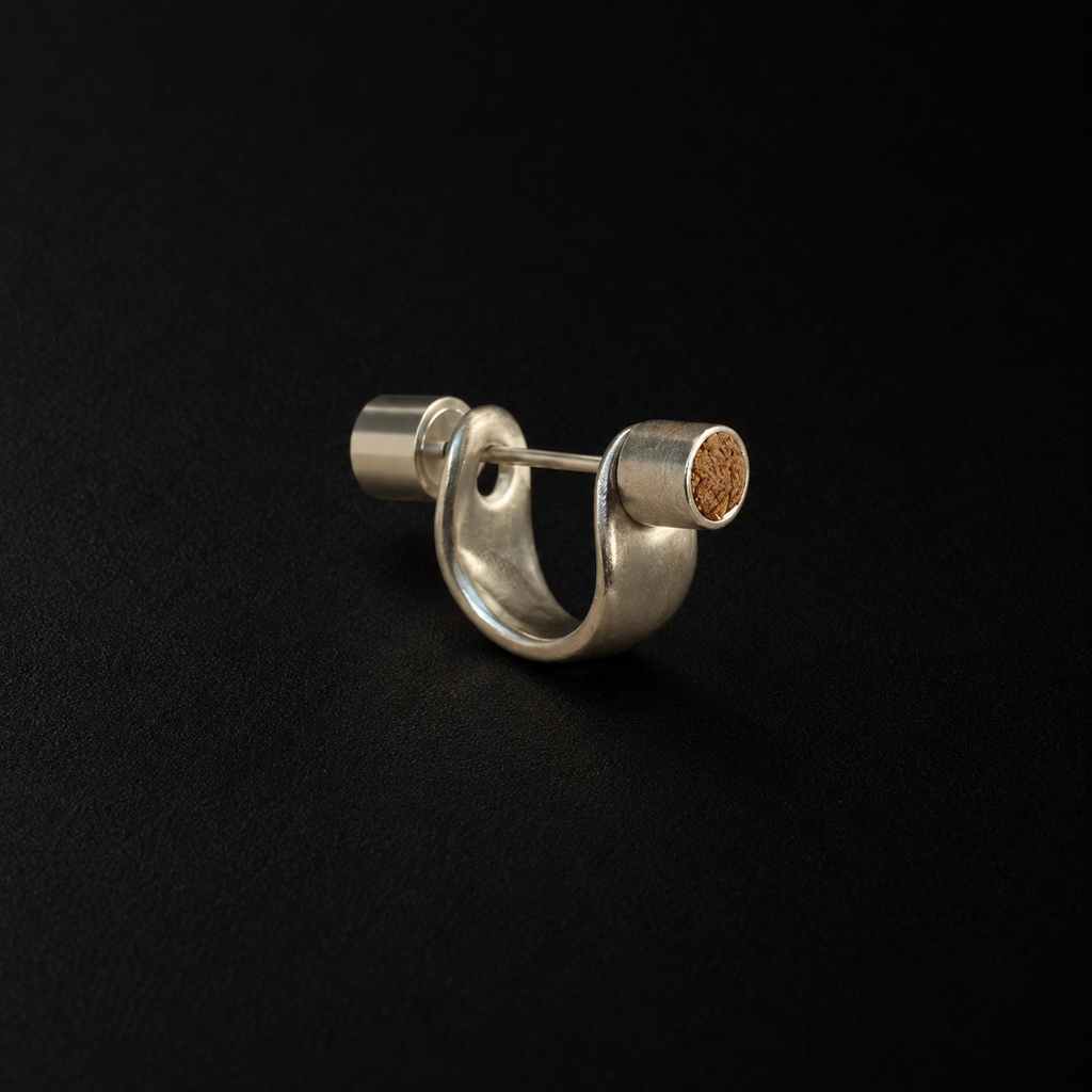 Front view of the Pebble Disc Huggie Earrings in studio light