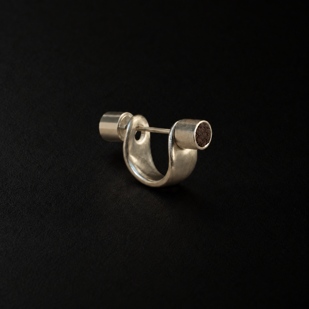 Back view of the Pebble Disc Huggie Earrings in studio light