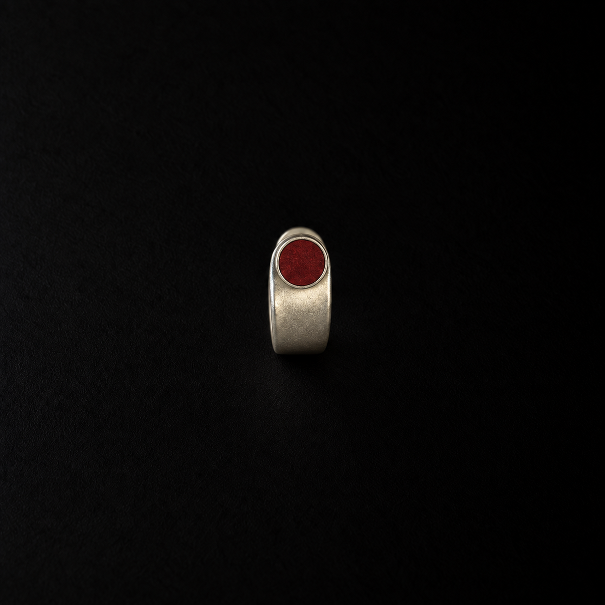 Close detail of the Pebble Disc Huggie Earrings by Lil Cacti