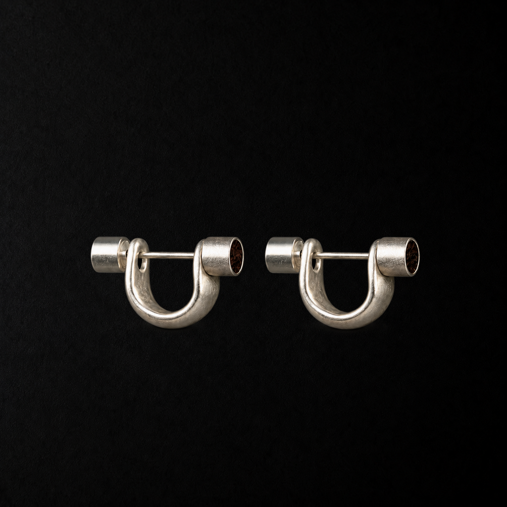 Close detail of the Pebble Disc Huggie Earrings by Lil Cacti