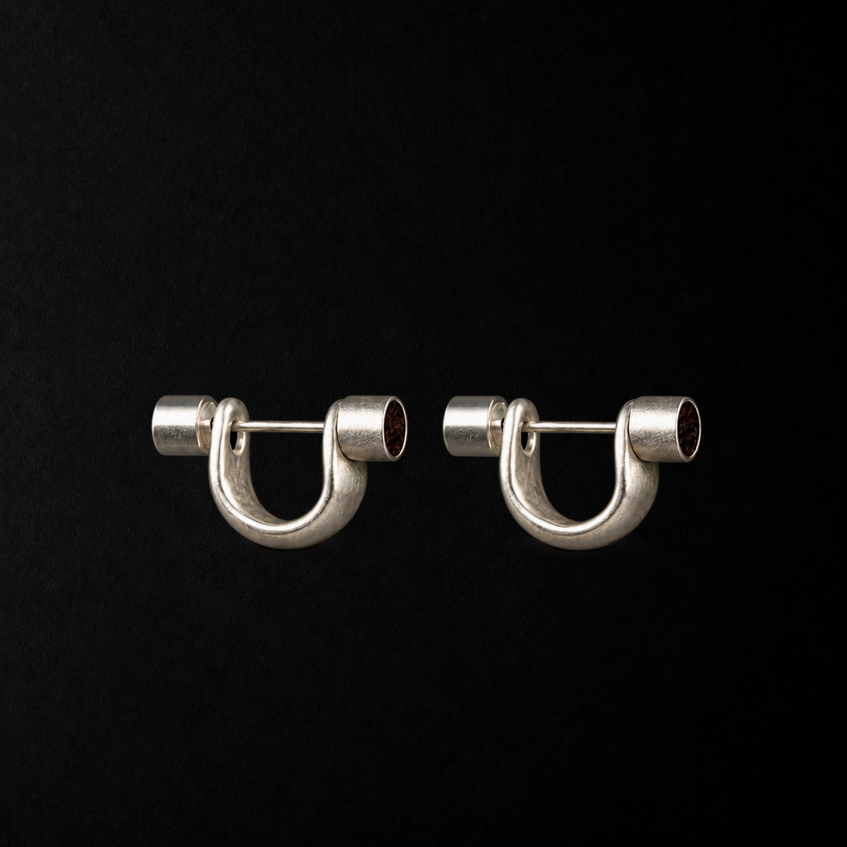 Close detail of the Pebble Disc Huggie Earrings by Lil Cacti