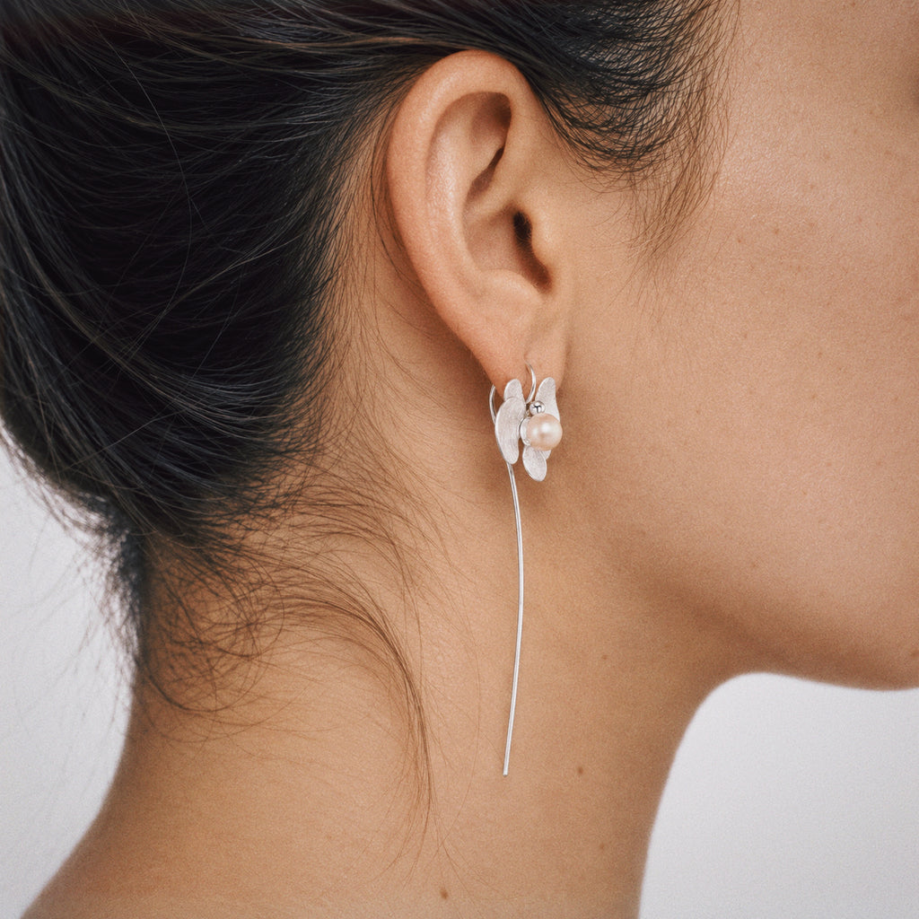 Orchid earrings from Lil Cacti: the Petal Orchid Drop Earrings shown from the side