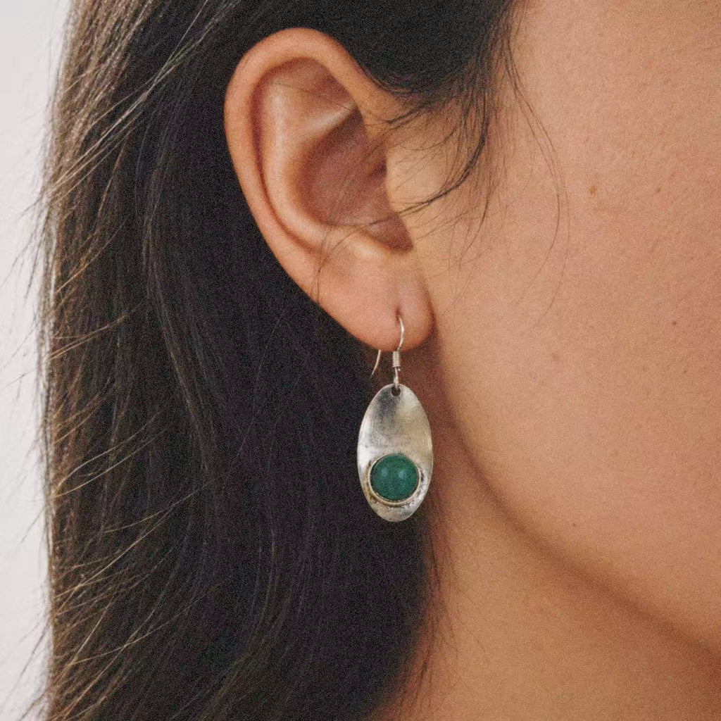 Close-up of the Relic Green Stone Drop Earrings, showing the finish and shape up close