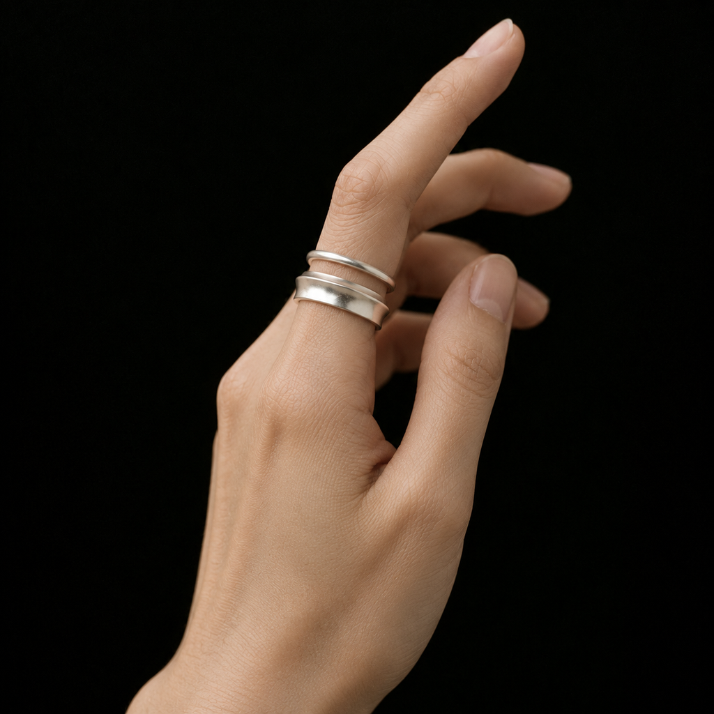 Model wearing the Ripple Band Ring in a close crop