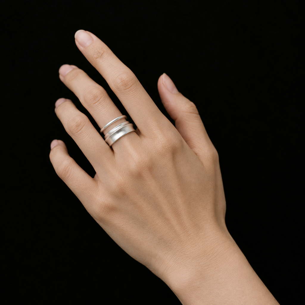 Model wearing the Ripple Band Ring from a low angle