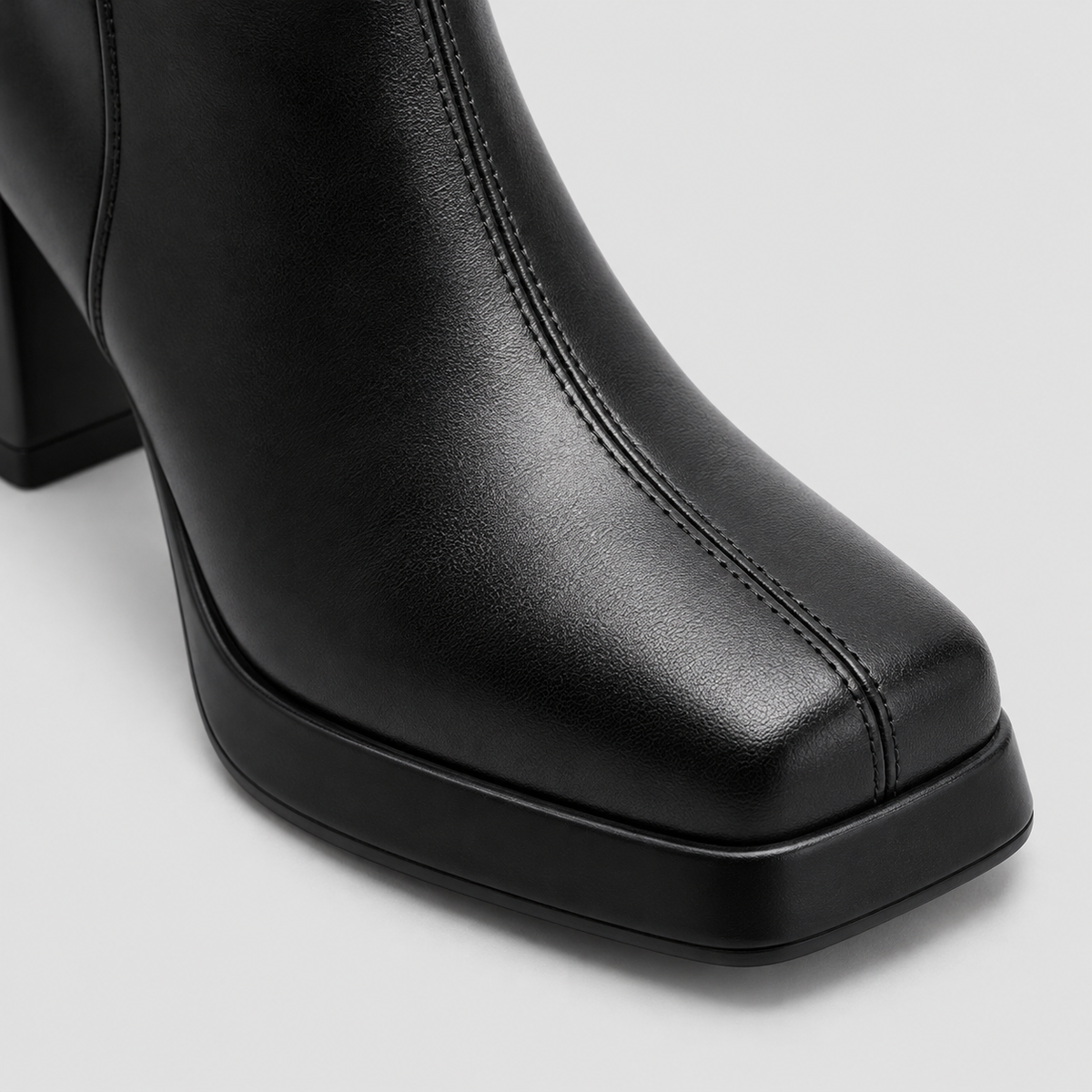 Close-up of Risa Square-Toe Chunky Heel Ankle Boots in black, highlighting the upper and finish