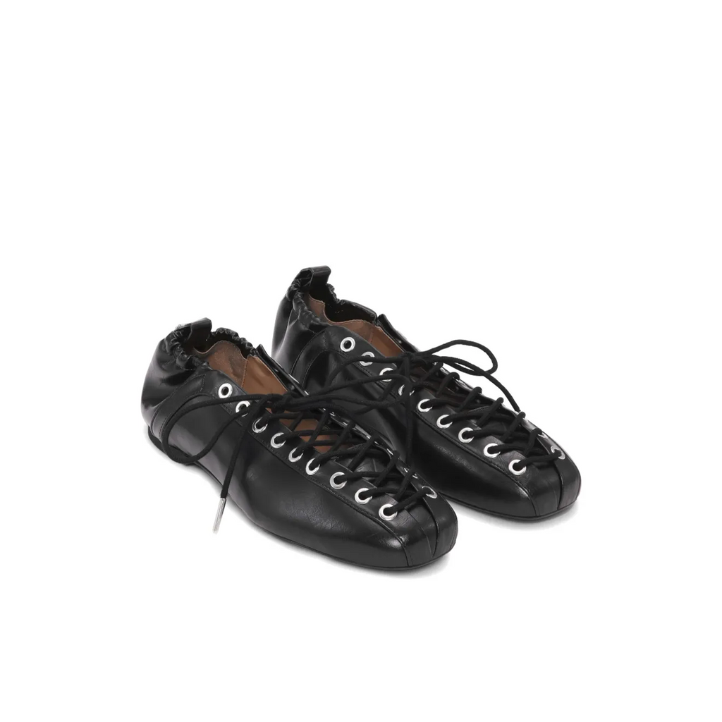 Pair of black leather lace-up ballet flats on a white background from lil cacti