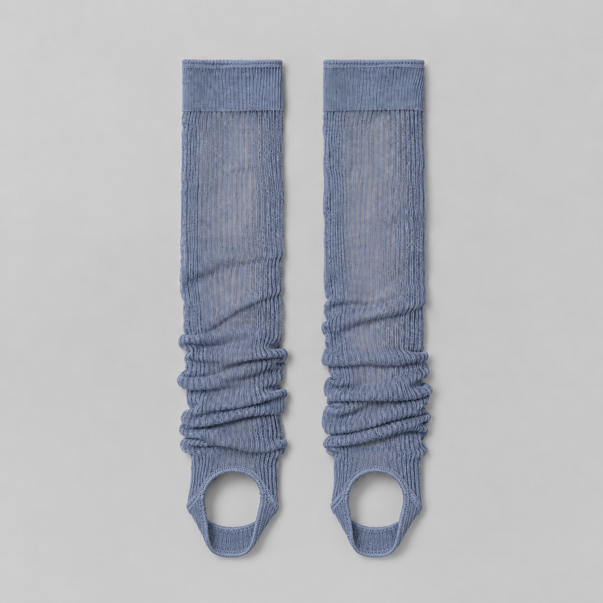 Lil Cacti haze blue ruched stirrup leg warmers laid flat on a pale background
