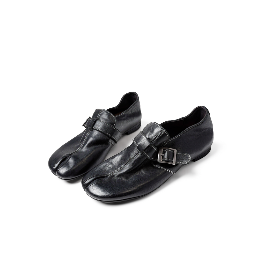 Side profile of Rue black tabi loafers showing loafer silhouette and split-toe detail
