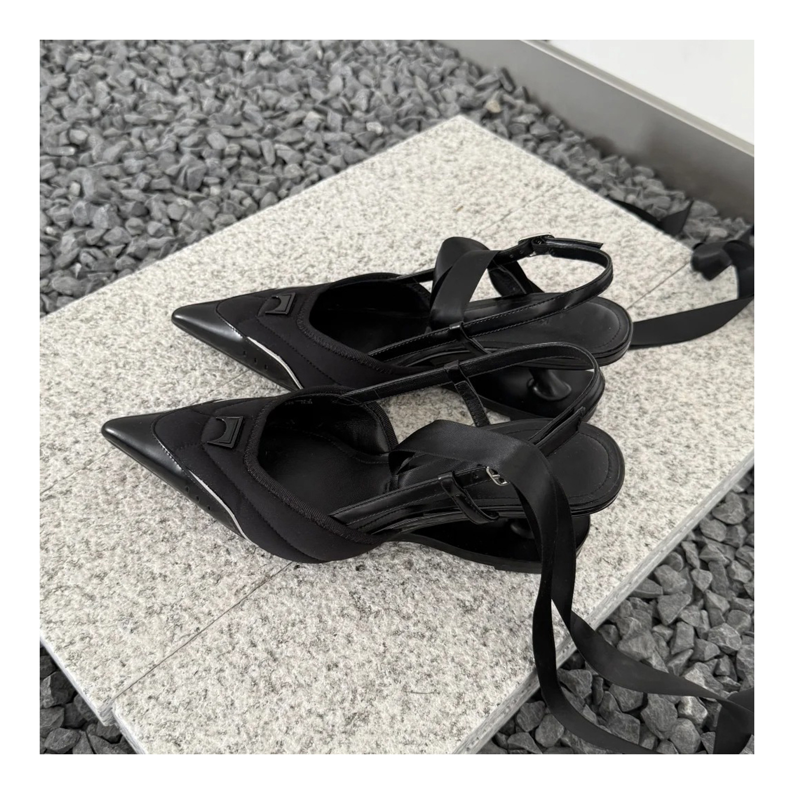Black pumps with refined slingback heels shape and ballet-inspired finish by Lil Cacti