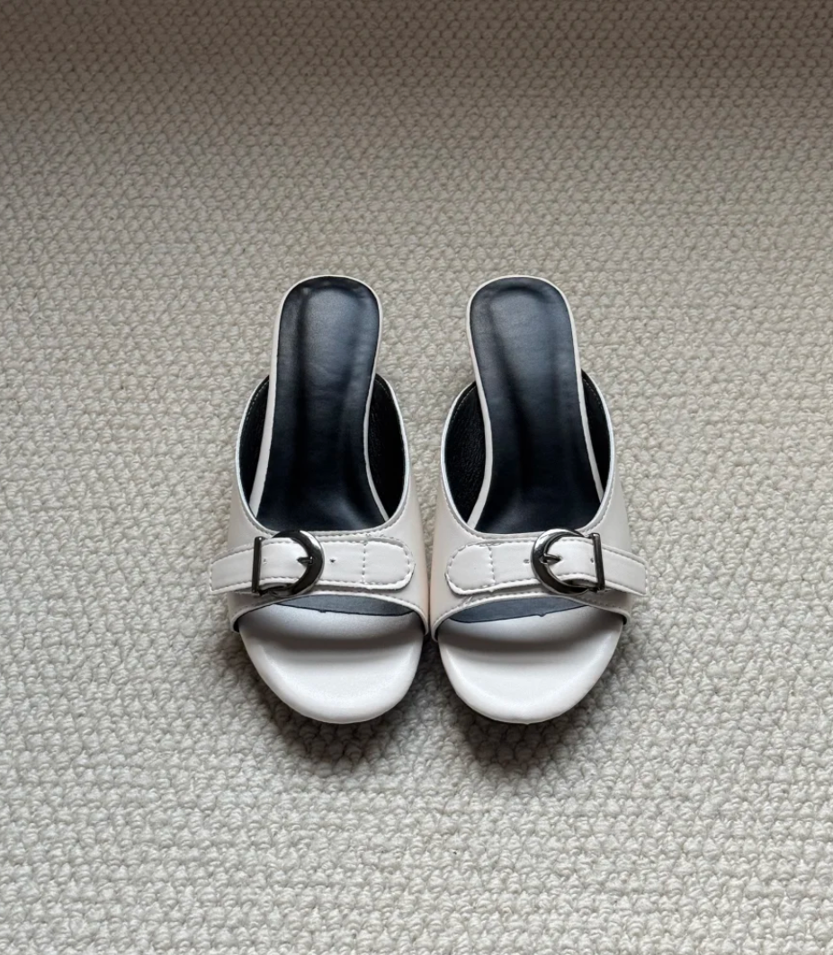 Back view of Belvra buckle mule heels showing open heel silhouette