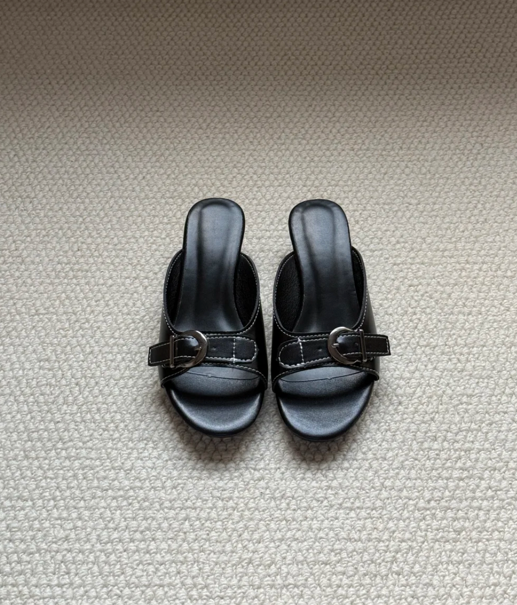 Belvra black mule heels top-down flatlay, dark feminine styling — Lil Cacti