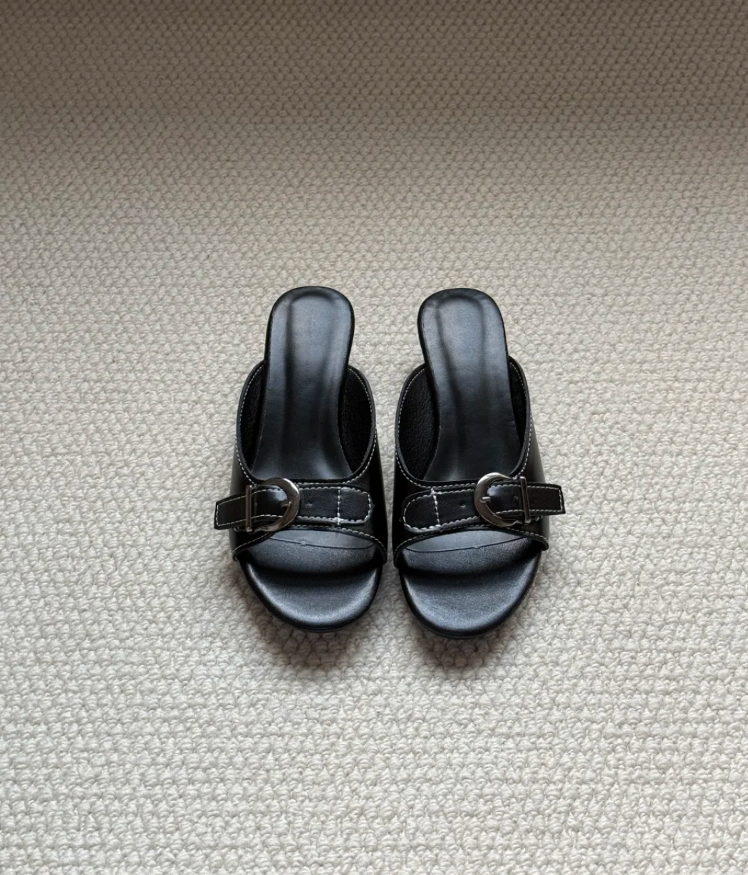 Belvra black mule heels top-down flatlay, dark feminine styling — Lil Cacti