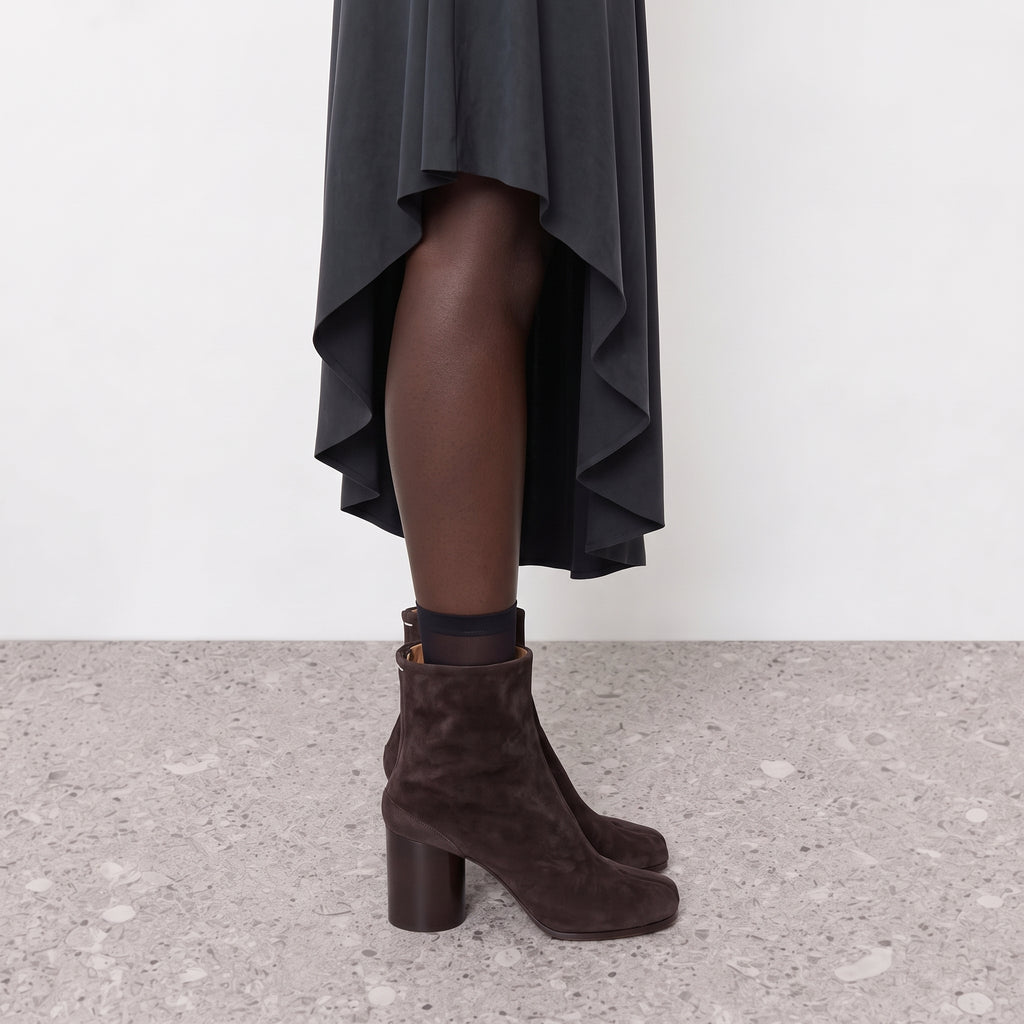 Model wearing the Sena Vegan Suede Tabi Ankle Boots seen from the front