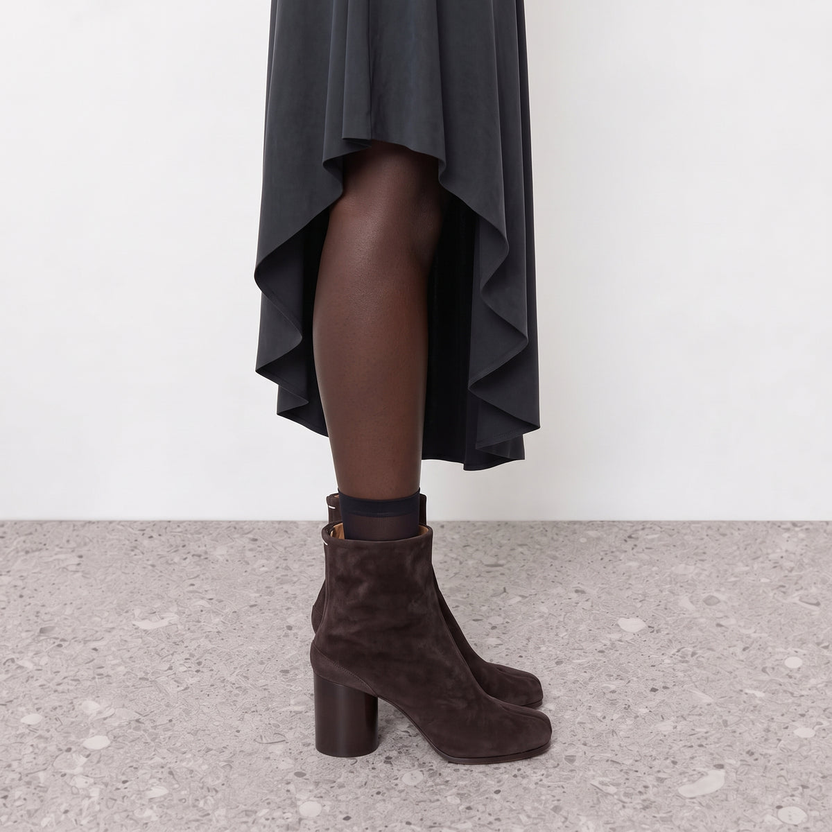 Model wearing the Sena Vegan Suede Tabi Ankle Boots seen from the front