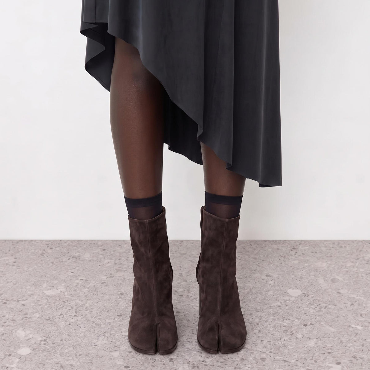 Model wearing the Sena Vegan Suede Tabi Ankle Boots seen from behind