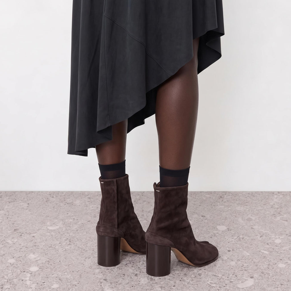 Model wearing the Sena Vegan Suede Tabi Ankle Boots in a close crop
