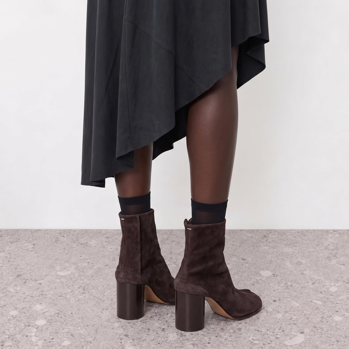 Model wearing the Sena Vegan Suede Tabi Ankle Boots in a close crop