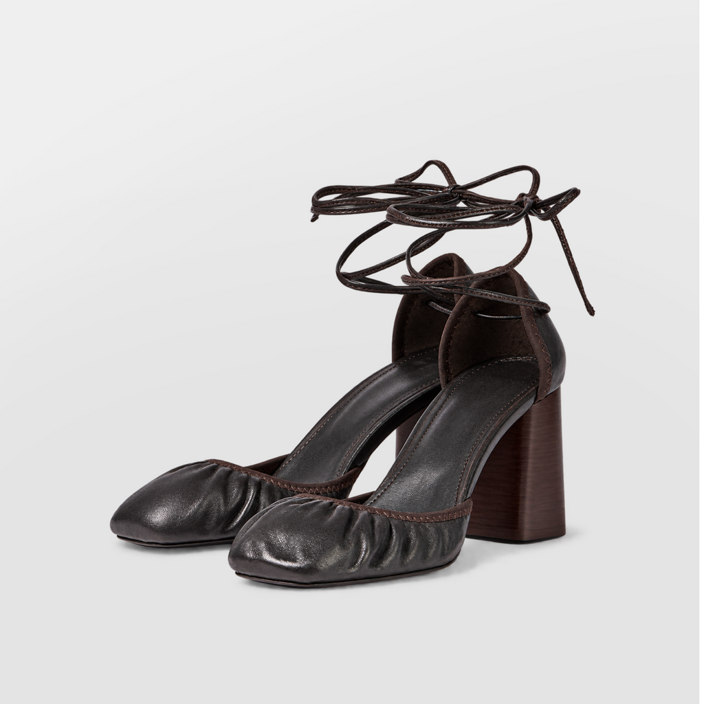 Front view of brown block heel pumps showing the closed round toe
