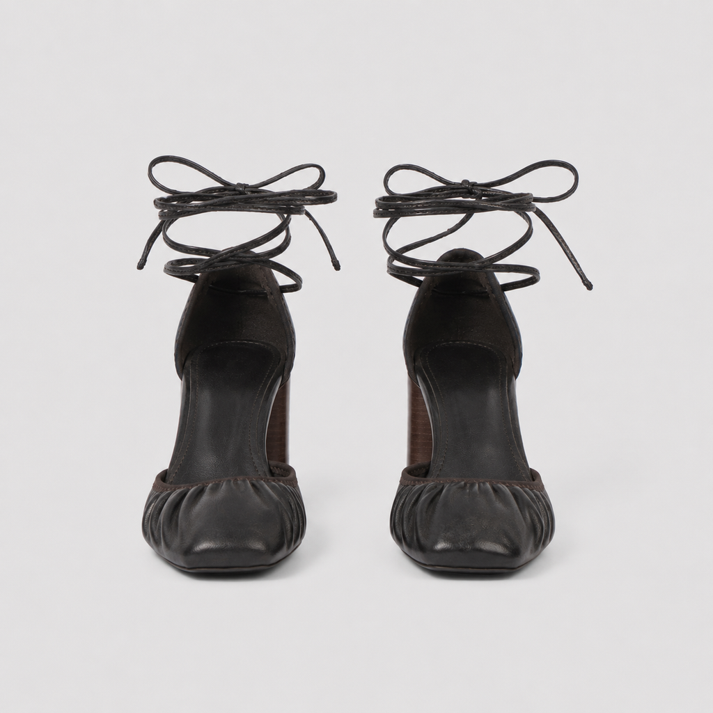 Angled view of brown tie up heels showing the low vamp and heel height