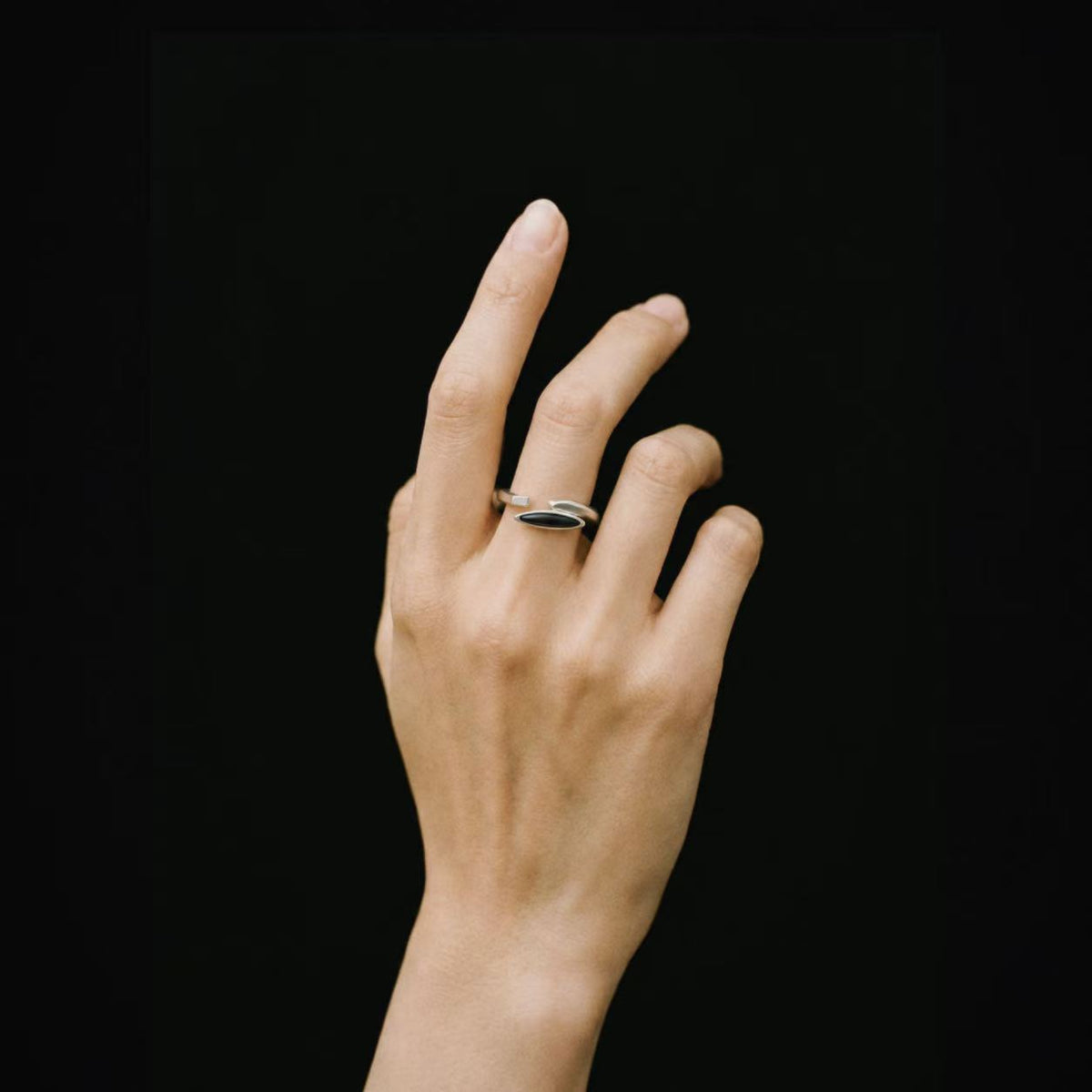 Model wearing Lil Cacti Shard Marquise Open Ring, close crop on the detail