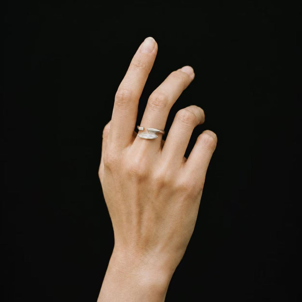 Model wearing the Shard Marquise Open Ring from a side angle