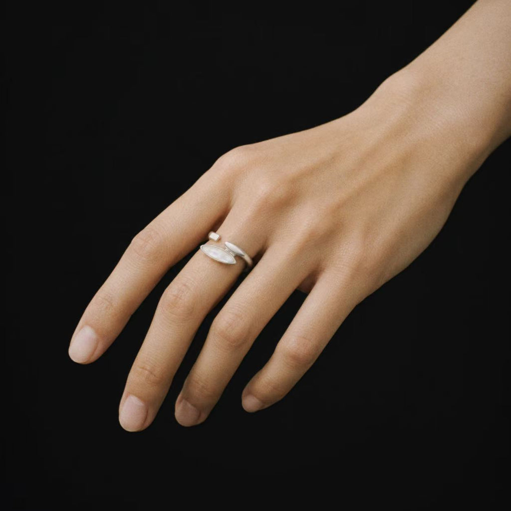 Model wearing the Shard Marquise Open Ring in soft daylight
