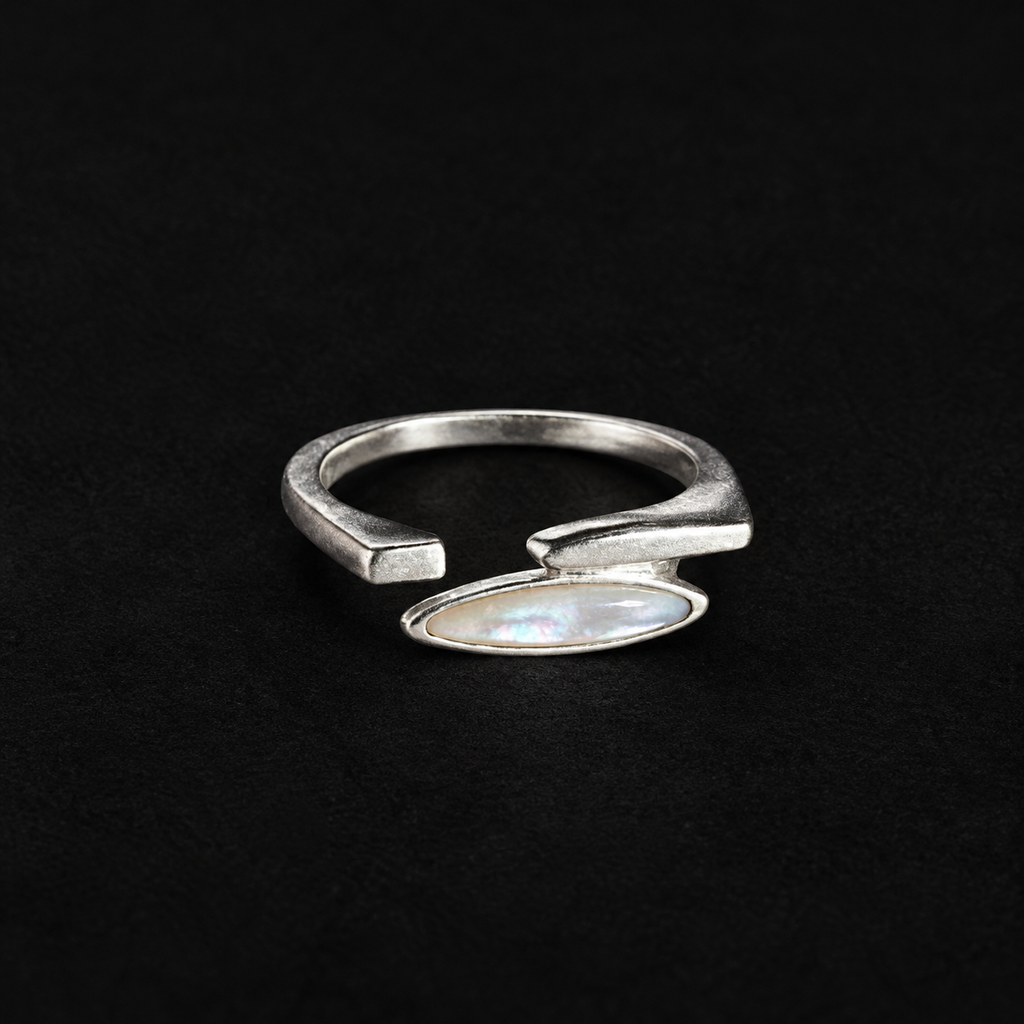 Pair of Shard Marquise Open Ring angled together on a dark background