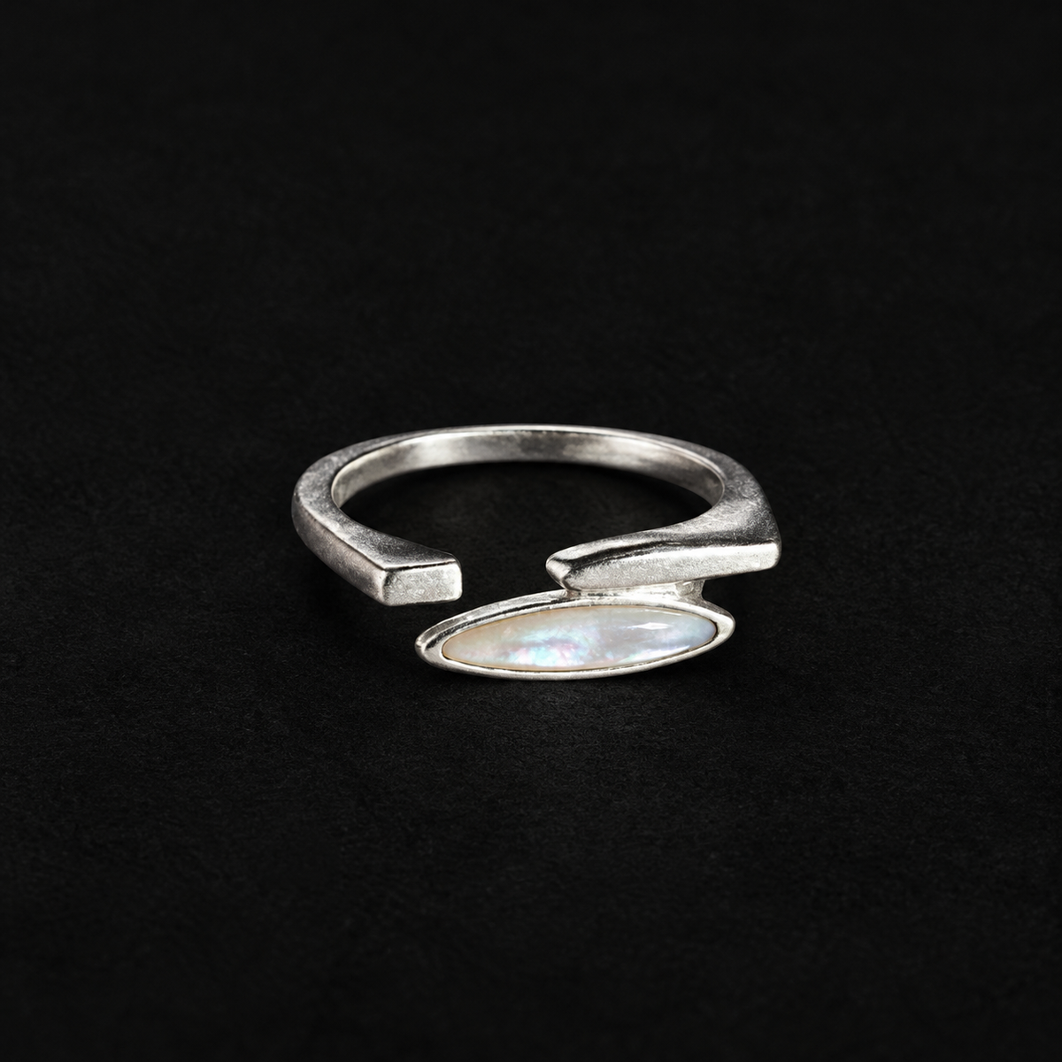 Pair of Shard Marquise Open Ring angled together on a dark background
